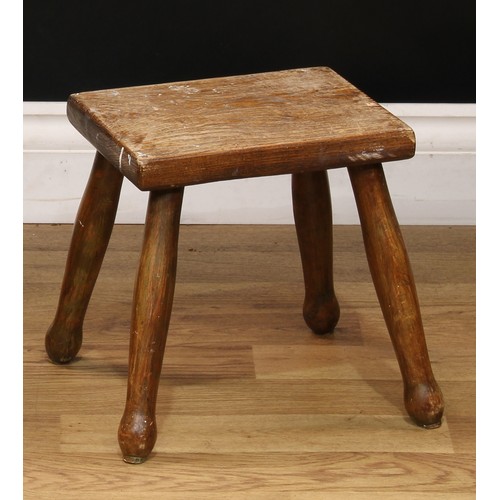 515 - An early 20th century elm milking stool, 18cm high;  another, elm and beech, 26cm high (2)