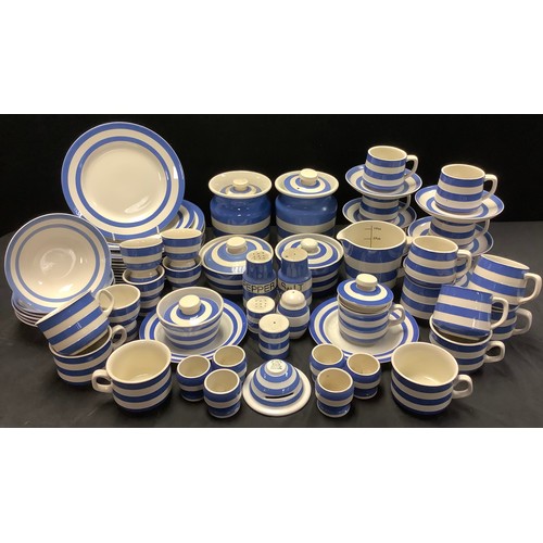 526 - T G Green Cornish Ware table ware including storage jars, plates, jug, cups and saucers, etc