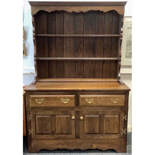 220 - A Griffiths oak dresser, as bespoke made for Harrods in 1977, 181cm tall x 121.5cm.