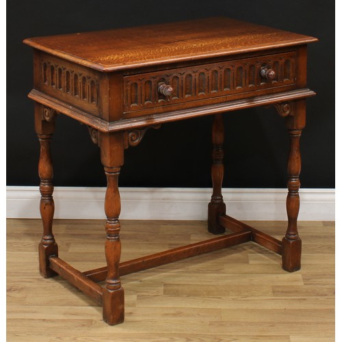 104 - A 17th century style oak side table, moulded rectangular top above a nulled frieze drawer, leafy scr... 