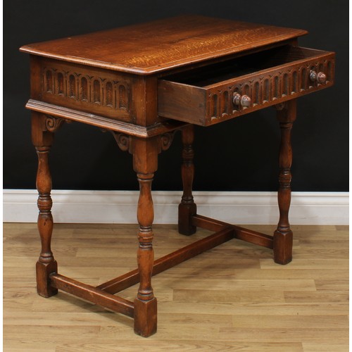 104 - A 17th century style oak side table, moulded rectangular top above a nulled frieze drawer, leafy scr... 