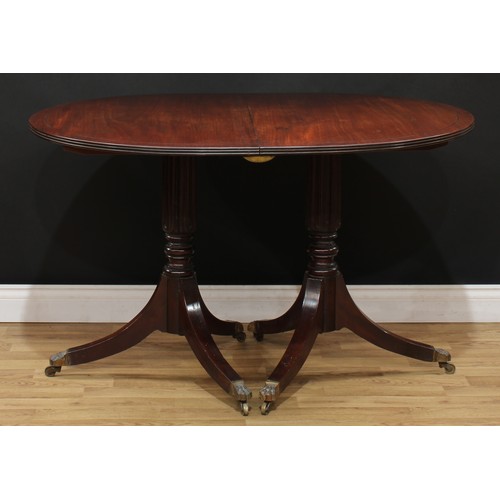 115 - A Regency style mahogany twin pillar dining table, 74.5cm high, 123cm extending to 183cm long, 91.5c... 