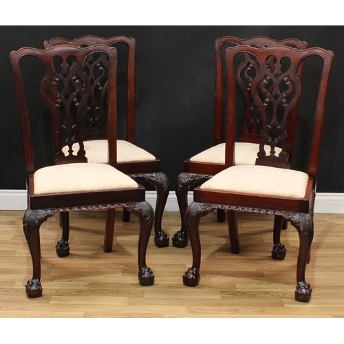 201 - A set of four Chippendale Revival mahogany dining chairs, each with a shaped and pierced splat, drop... 