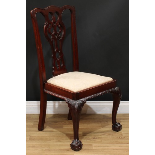 201 - A set of four Chippendale Revival mahogany dining chairs, each with a shaped and pierced splat, drop... 