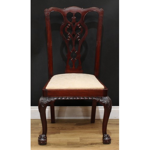 201 - A set of four Chippendale Revival mahogany dining chairs, each with a shaped and pierced splat, drop... 