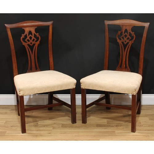 201 - A set of four Chippendale Revival mahogany dining chairs, each with a shaped and pierced splat, drop... 