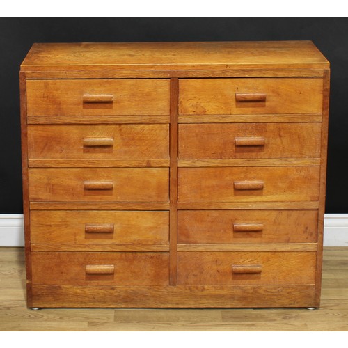 202 - A mid-20th century oak and veneer desk, rectangular top above a pair of slides and an arrangement of... 