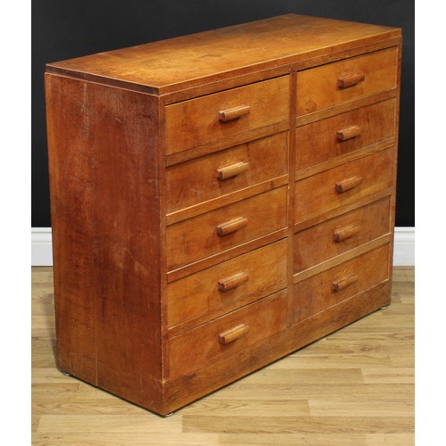 202 - A mid-20th century oak and veneer desk, rectangular top above a pair of slides and an arrangement of... 