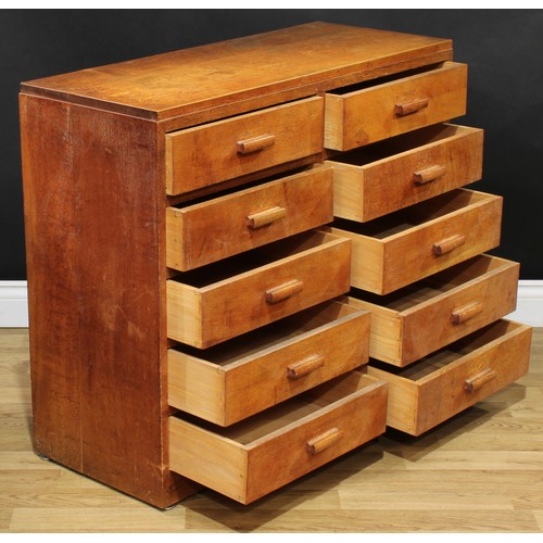 202 - A mid-20th century oak and veneer desk, rectangular top above a pair of slides and an arrangement of... 