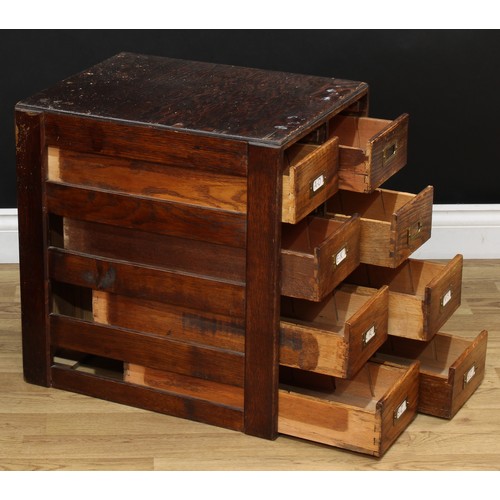 202 - A mid-20th century oak and veneer desk, rectangular top above a pair of slides and an arrangement of... 