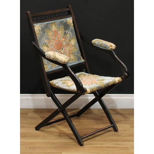 207 - A late 19th century ebonised campaign type steamer chair, 87cm high, 53.5cm wide, the seat 36cm wide... 