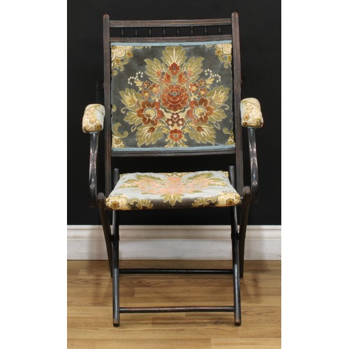 207 - A late 19th century ebonised campaign type steamer chair, 87cm high, 53.5cm wide, the seat 36cm wide... 