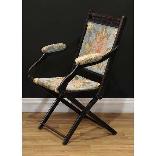 207 - A late 19th century ebonised campaign type steamer chair, 87cm high, 53.5cm wide, the seat 36cm wide... 