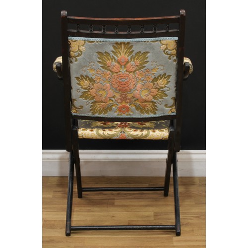 207 - A late 19th century ebonised campaign type steamer chair, 87cm high, 53.5cm wide, the seat 36cm wide... 