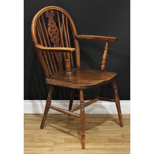 220 - A set of sixteen wheelback Windsor type dining chairs, 90.5cm high, 40.5cm wide, the seat 37cm wide ... 