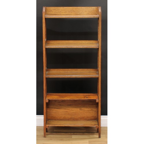 216 - An Arts & Crafts design open bookcase, 128cm high, 55cm wide, 19.5cm deep; an early-mid 20th century... 