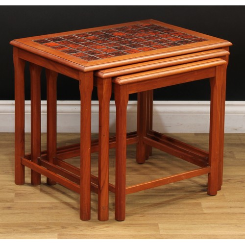 606 - A nest of three Danish retro mid-20th century tile-top occasional tables, the largest 48cm high, 57c... 