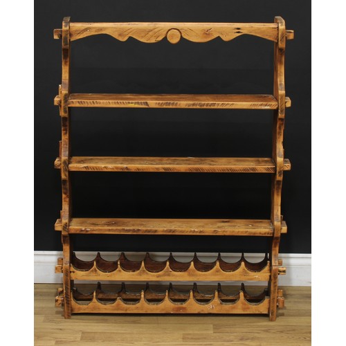 617 - A pine kitchen shelf with wine rack, 102cm high, 79cm wide, 16.5cm deep; two rope seat stools, 47cm ... 