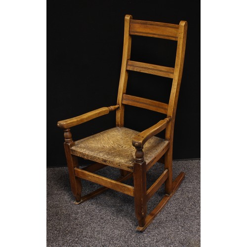 627 - A country house ladder back rocking chair, rush seat; a similar stool; a pair of Victorian balloon b... 