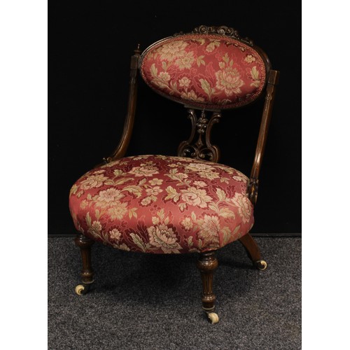 629 - A Victorian mahogany boudoir chair, oval cresting rail carved and applied with scrolling acanthus, s... 