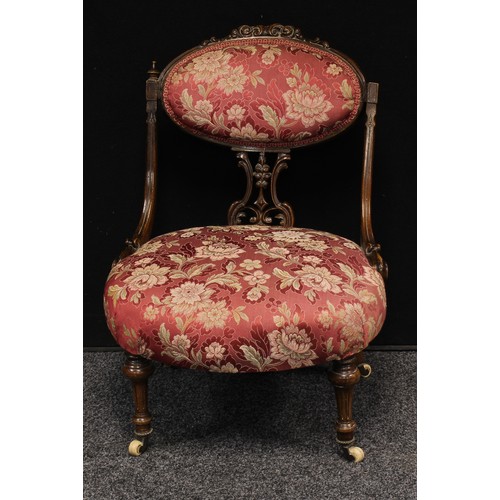 629 - A Victorian mahogany boudoir chair, oval cresting rail carved and applied with scrolling acanthus, s... 