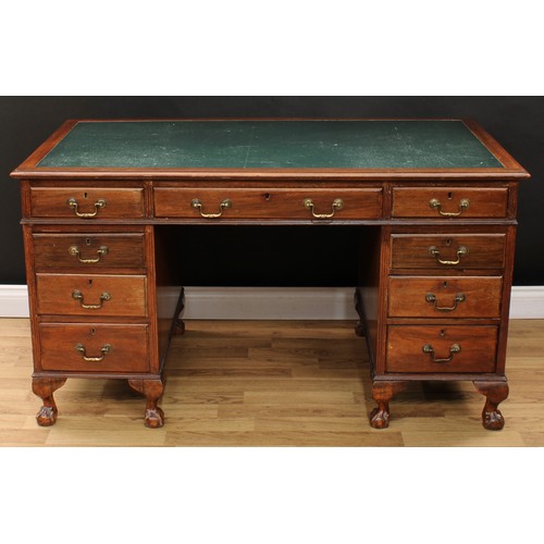 630 - An early-mid 20th century mahogany twin pedestal desk, rectangular top with inset writing surface ab... 