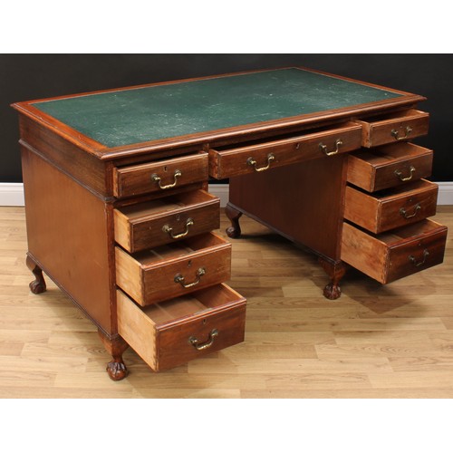 630 - An early-mid 20th century mahogany twin pedestal desk, rectangular top with inset writing surface ab... 