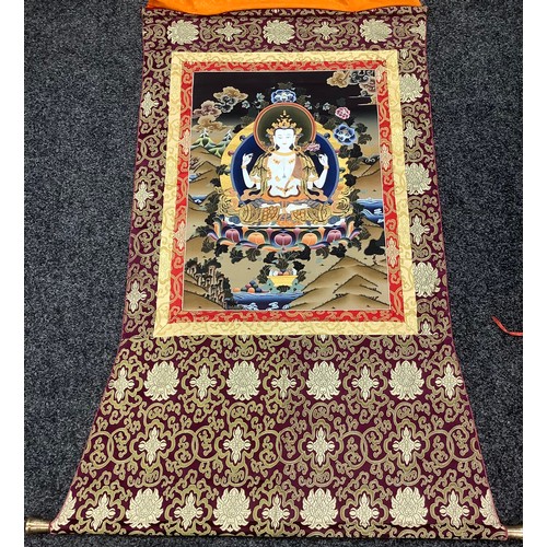 632 - A Tibetan wall hanging scroll, central panel with Tara, approximately 130cm x 85cm