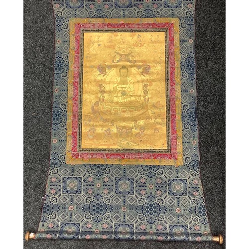 636 - A Tibetan wall hanging scroll, central panel with Medicine Buddha, approximately 158cm x 103cm