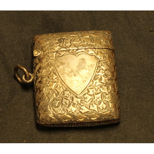 650 - A Victorian rectangular silver vesta case, engraved and chased overall with stylised vine leaves, 5c... 