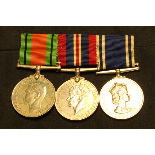 653 - World War II medals, a set of three 1939 - 1945 Defense medal, Service medal, For Exemplary Police S... 