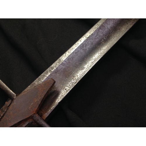 63 - An 18th century cavalry sabre, 83.5cm curved blade engraved with triumphal regalia and flowering lea... 