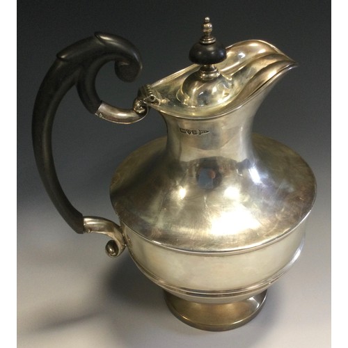 288 - An Edwardian silver hot water jug, half girdle, ebonised scroll handle, button finial, 24cm high, Wa... 