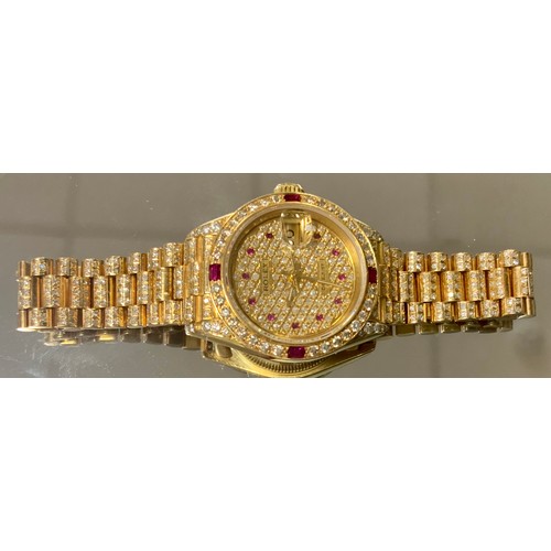 345 - Rolex - a lady's Datejust diamond and ruby encrusted 18ct gold bracelet wristwatch, all over pave se... 