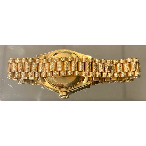 345 - Rolex - a lady's Datejust diamond and ruby encrusted 18ct gold bracelet wristwatch, all over pave se... 