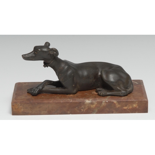 1962 - French School (19th century), a dark patinated bronze, of a recumbent hound, rectangular marble base... 