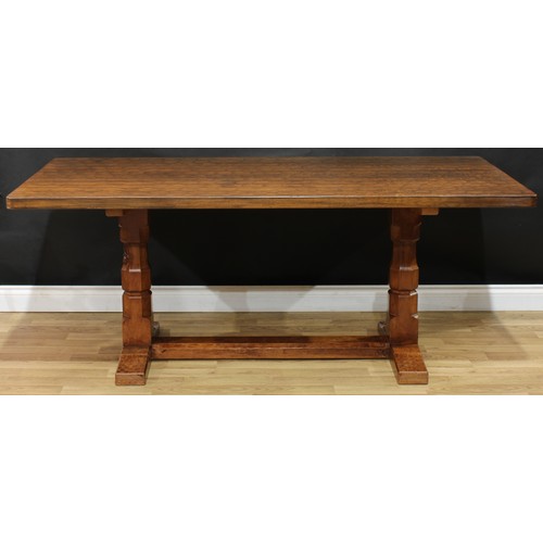 1970 - Robert Thompson, Mouseman of Kilburn - an oak refectory trestle dining table, adzed rectangular top,... 