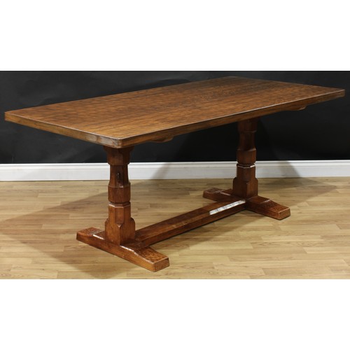 1970 - Robert Thompson, Mouseman of Kilburn - an oak refectory trestle dining table, adzed rectangular top,... 