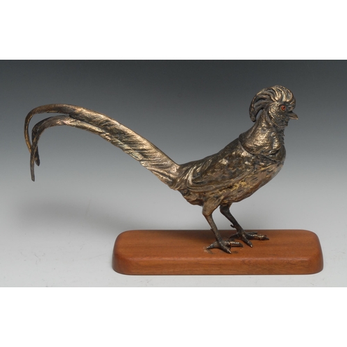 296 - An Elizabeth II silver gilt table decoration, as a pheasant, glass eyes, 36cm long, London 1974, 57.... 