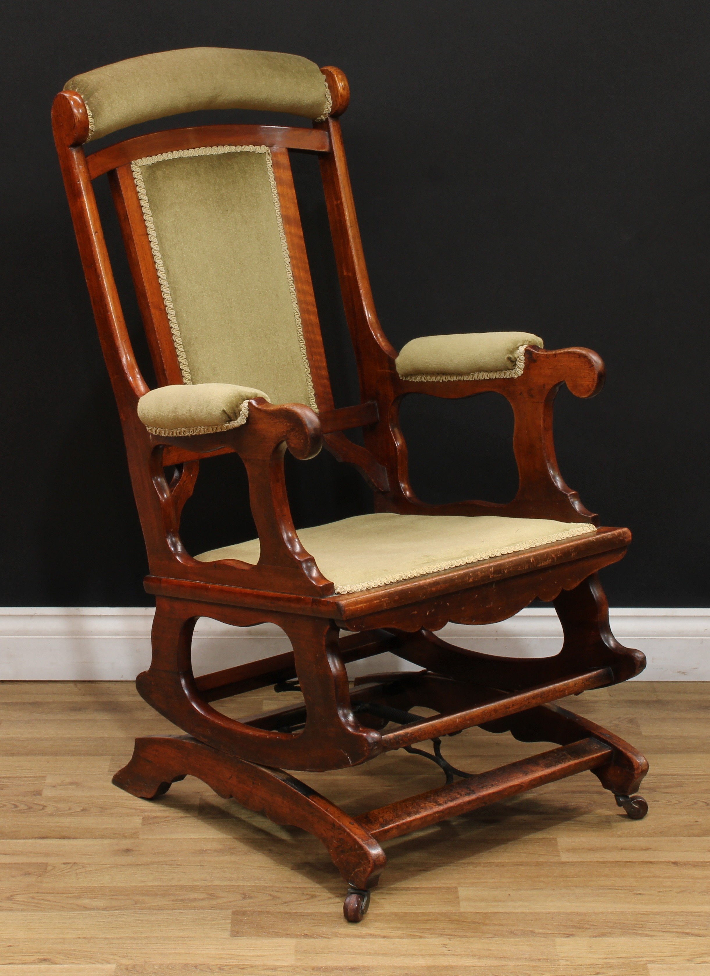 A late 19th century American spring rocking chair, stuffed-over