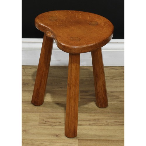 1971 - Robert Thompson, Mouseman of Kilburn - an oak stool, of staked construction, adzed kidney shaped top... 