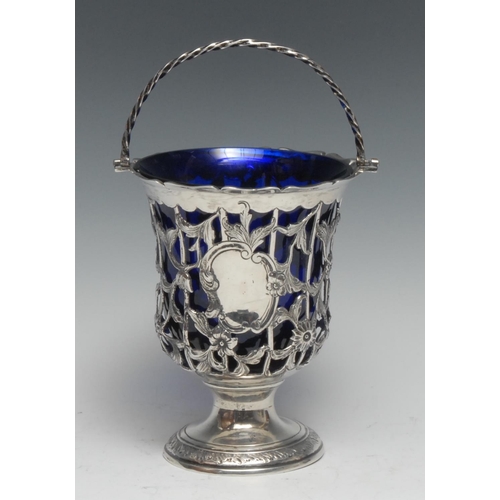 261 - An 18th century silver pedestal sugar basket, pierced and embossed with a trellis of flowers and scr... 