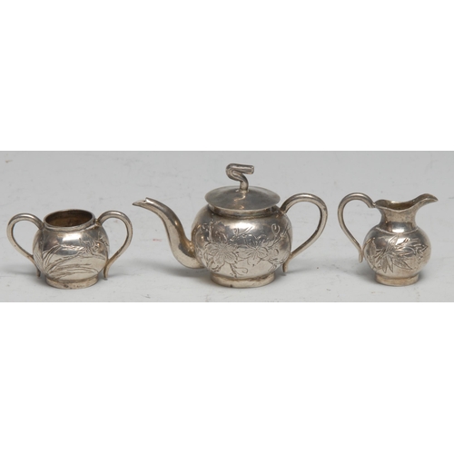 82 - A Chinese silver miniature three piece globular tea service, comprising teapot, milk jug and sugar b... 