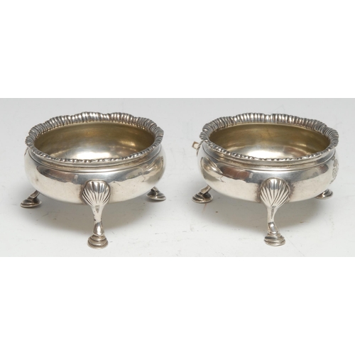 315 - Hester Bateman - a pair of George III silver cauldron salts, shaped everted rim, hoof feet with shel... 