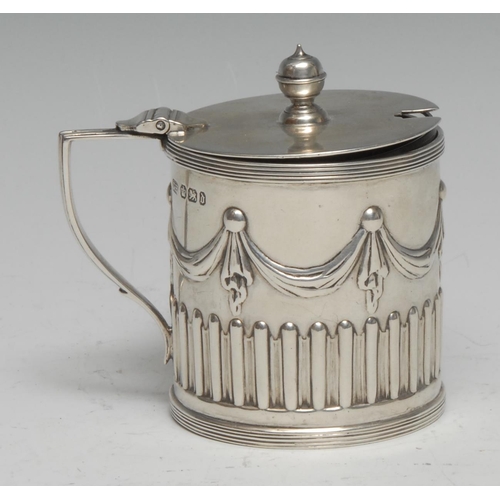 226 - A Victorian Adam Revival silver drum mustard, half-fluted and chased with swags and pendants, hinged... 