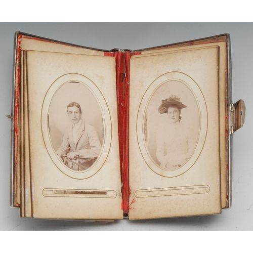 229 - A Victorian silver and enamel rectangular carte de visite album, the cover decorated en-grisaille in... 