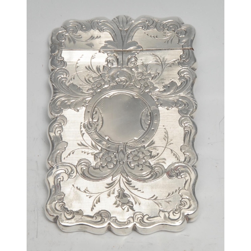 251 - A Victorian silver shaped rectangular visiting card case, bright-cut engraved with scrolling foliage... 