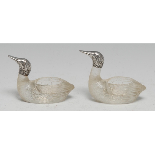 169 - A pair of early 20th century silver mounted novelty salts, as ducks, 7.5cm long, marked 800, c.1910