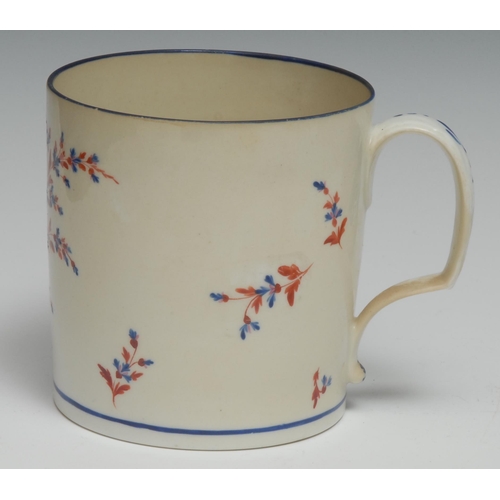 665 - A Pinxton porter mug, enamelled in and blue and red spray and scattered sprigs,  blue rim, 11cm high... 