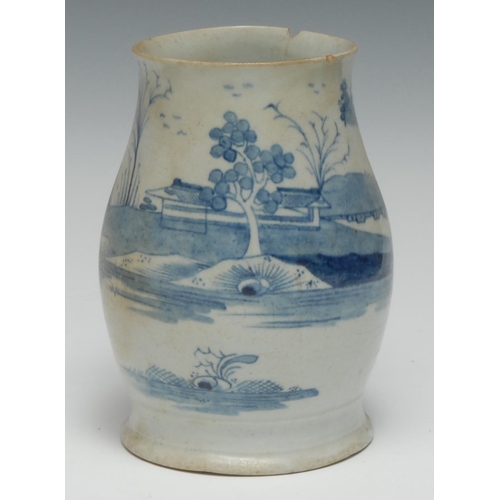 493 - A Longton Hall ale mug, painted in underglaze blue with  stylised trees and landscape, crabstock han... 